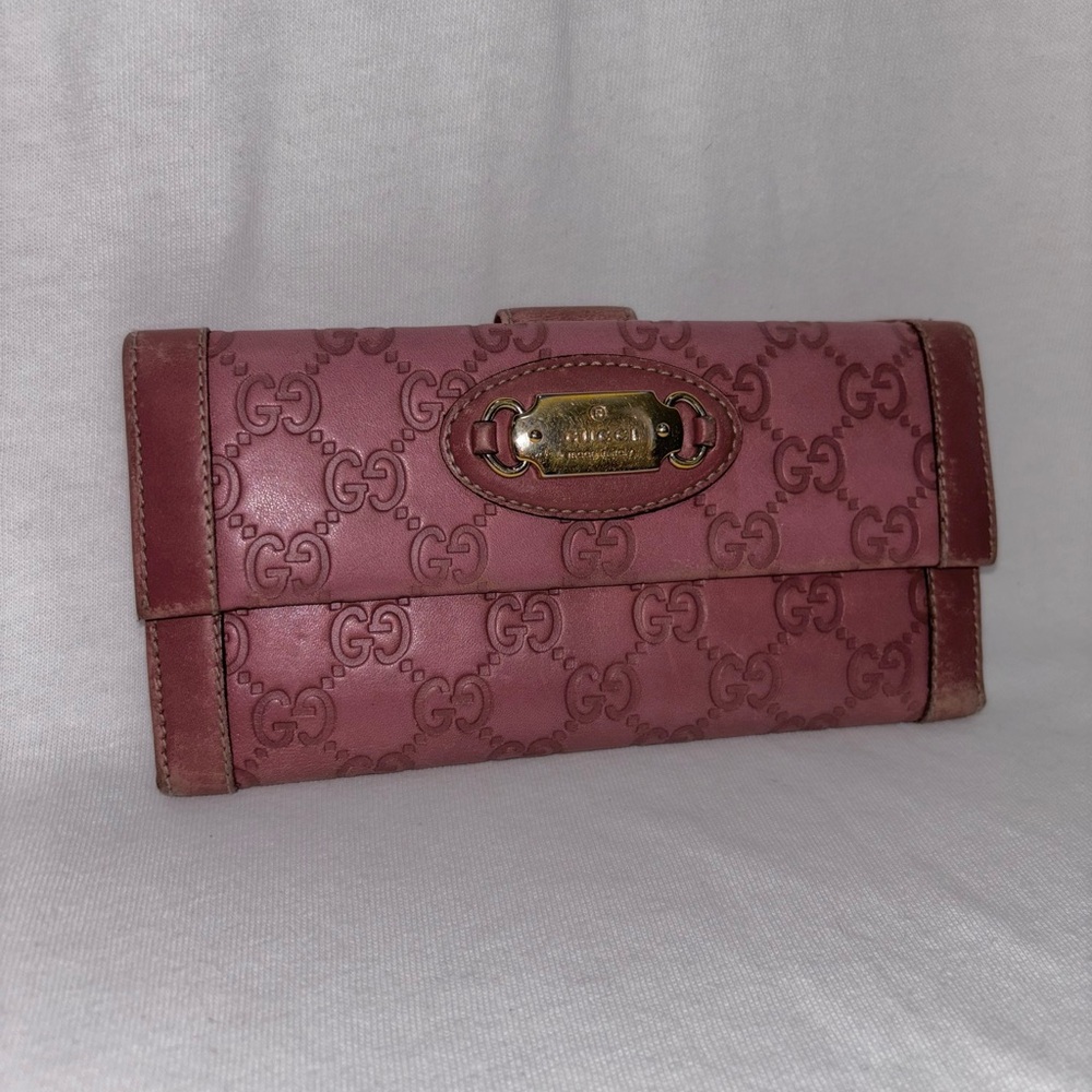 Long pink gucci wallet with logo print and metal snap button closures